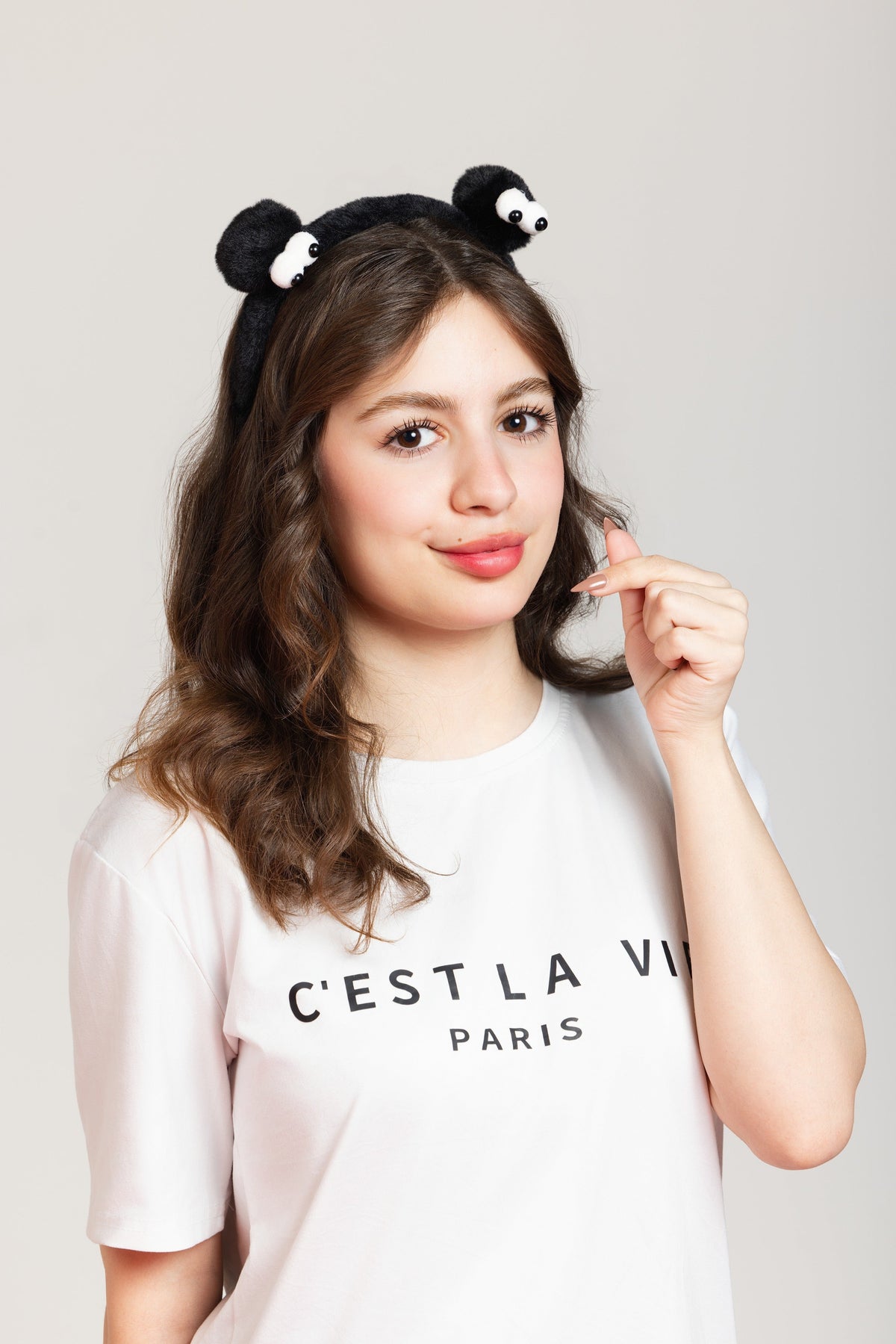 Fascia per capelli in peluche nero con occhi buffi – Immagine 1